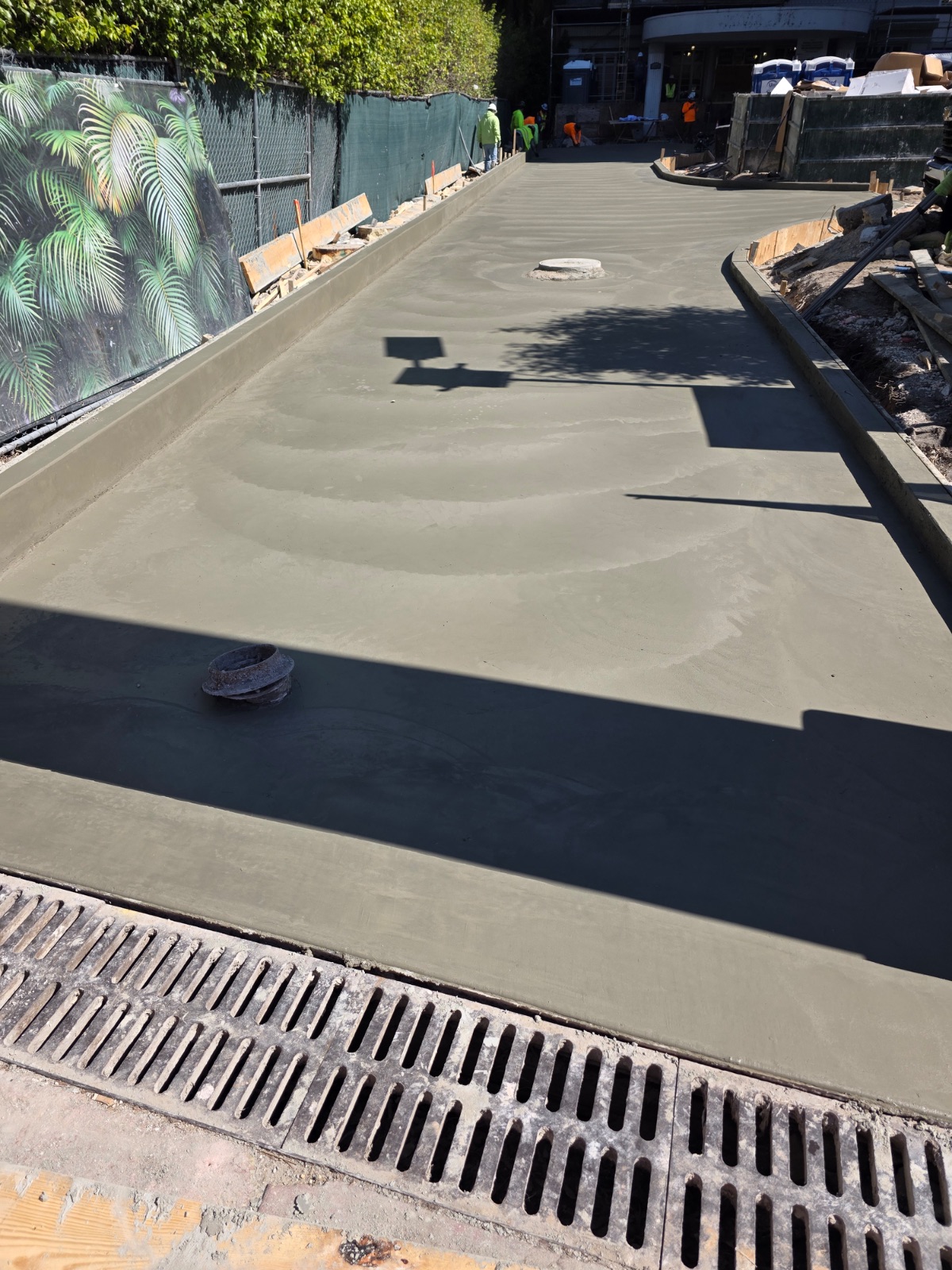 Poured slab with broom finish and drainage grate